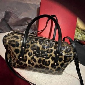 Kate Spade New York satchel w shoulder strap. Blk & cream Animal print design.
